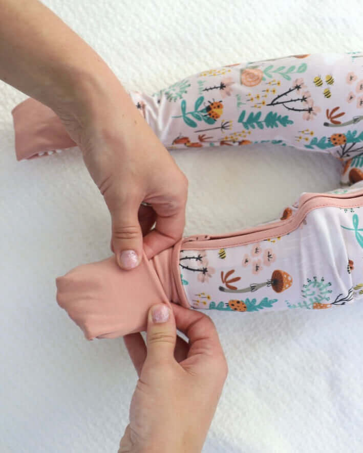 Bamboo for Babies: What’s Safe, What’s Hype and How to Choose - A person adjusting bamboo babywear on a child.