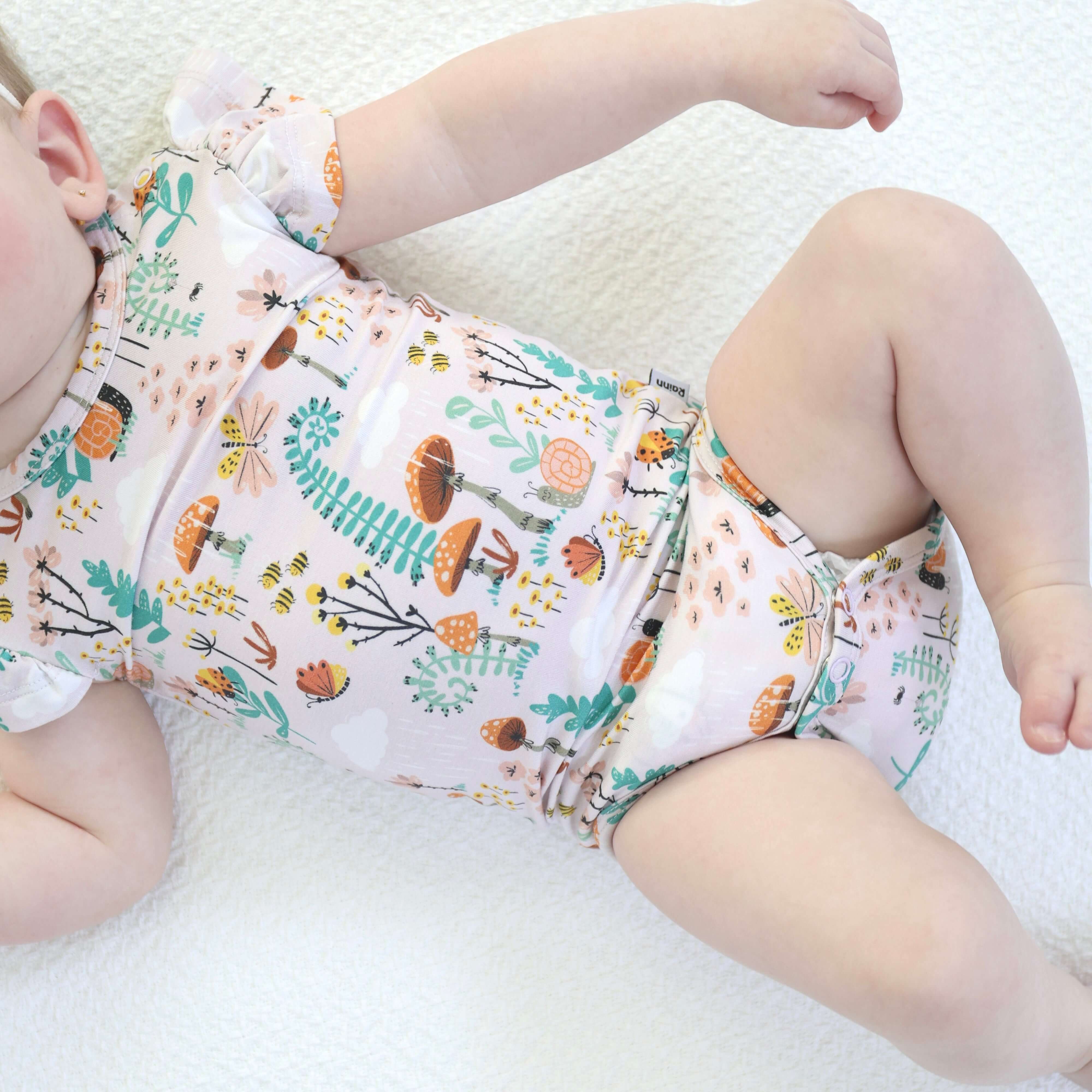 Bamboo onsie in fern design, soft and breathable, perfect for cozy days and playful moments.