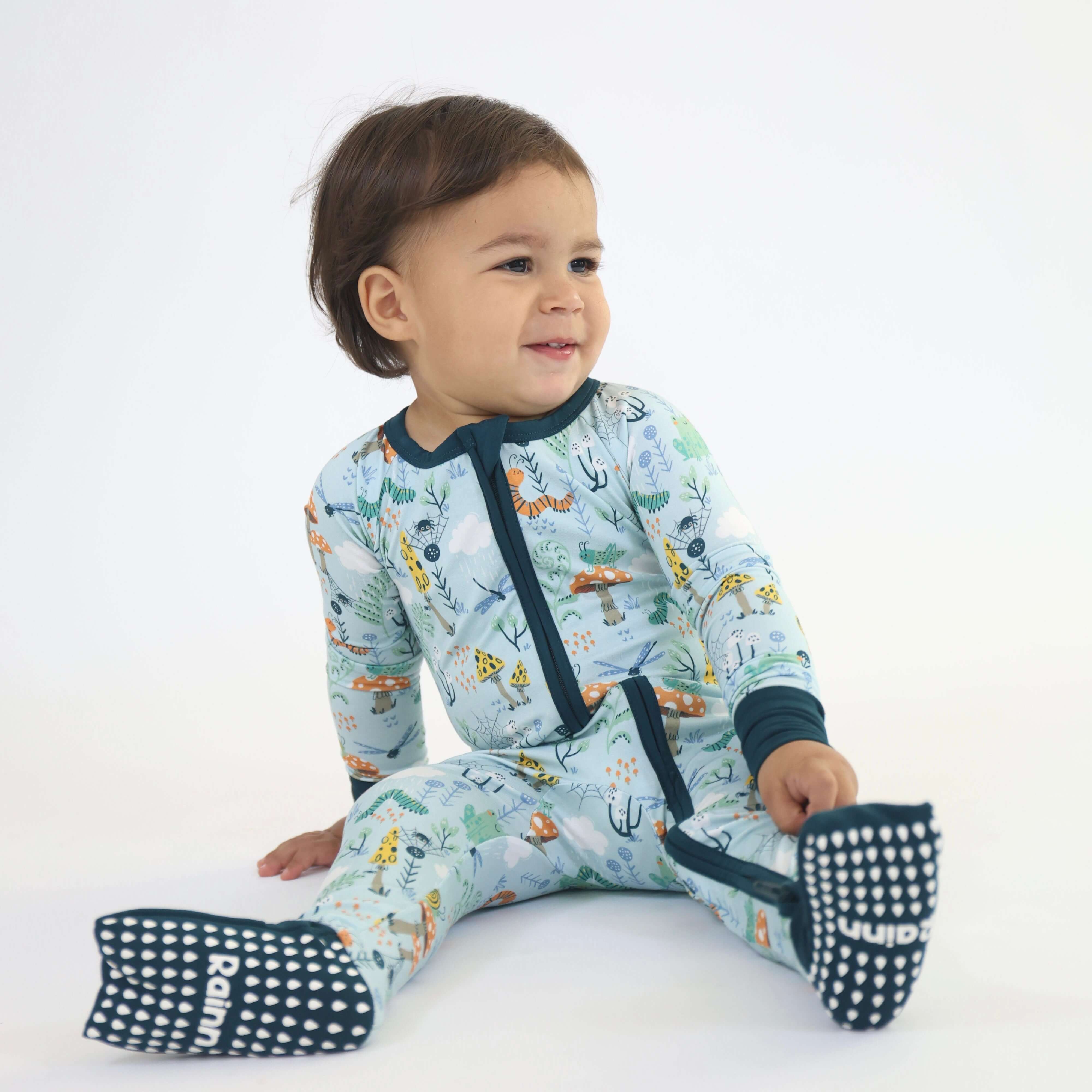 Toddler in Critter Hollow Zipp Jammies, featuring nature-inspired RainnWeave™ bamboo fabric, comfy and playful design.