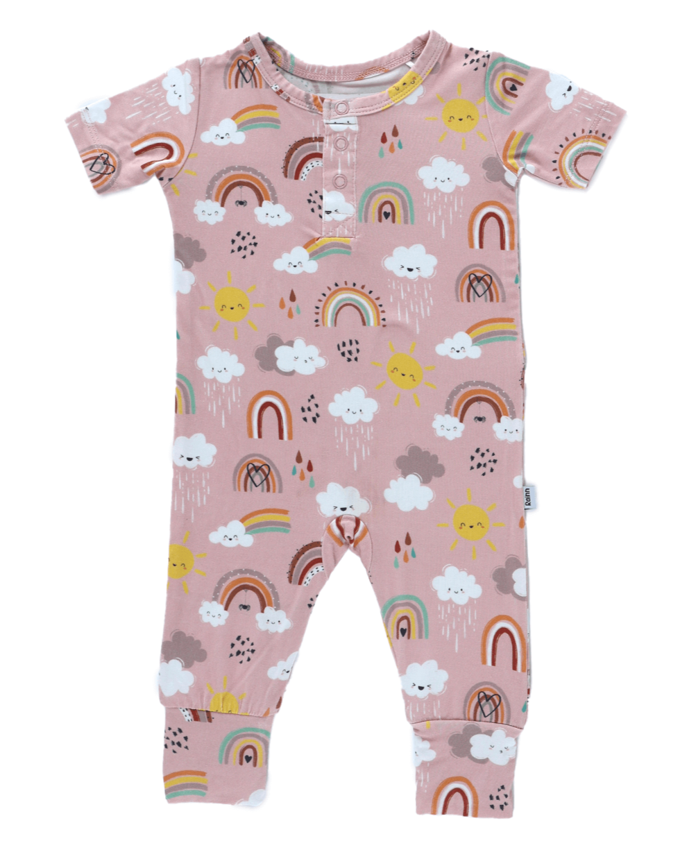 Bamboo Pull Up Romper with colorful rainbows, suns, and clouds on a soft fabric.